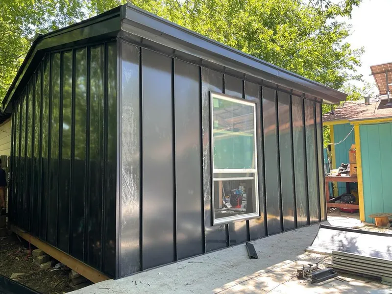 Black standing seam metal wall panels for Roof Inspection in Castle Rock