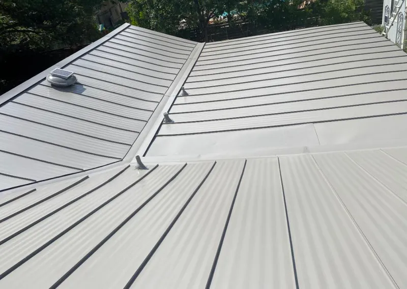 Solar attic fan installed on a metal roof for Roof Ventilation in Castle Rock